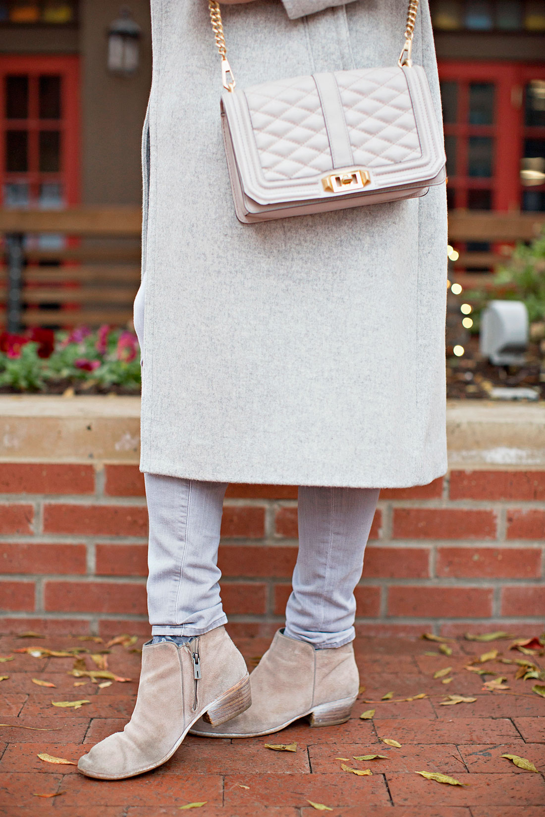 Best Luxury Designers Handbags blogger Amanda shares flight essentials including the Sam Edelman Petty booties