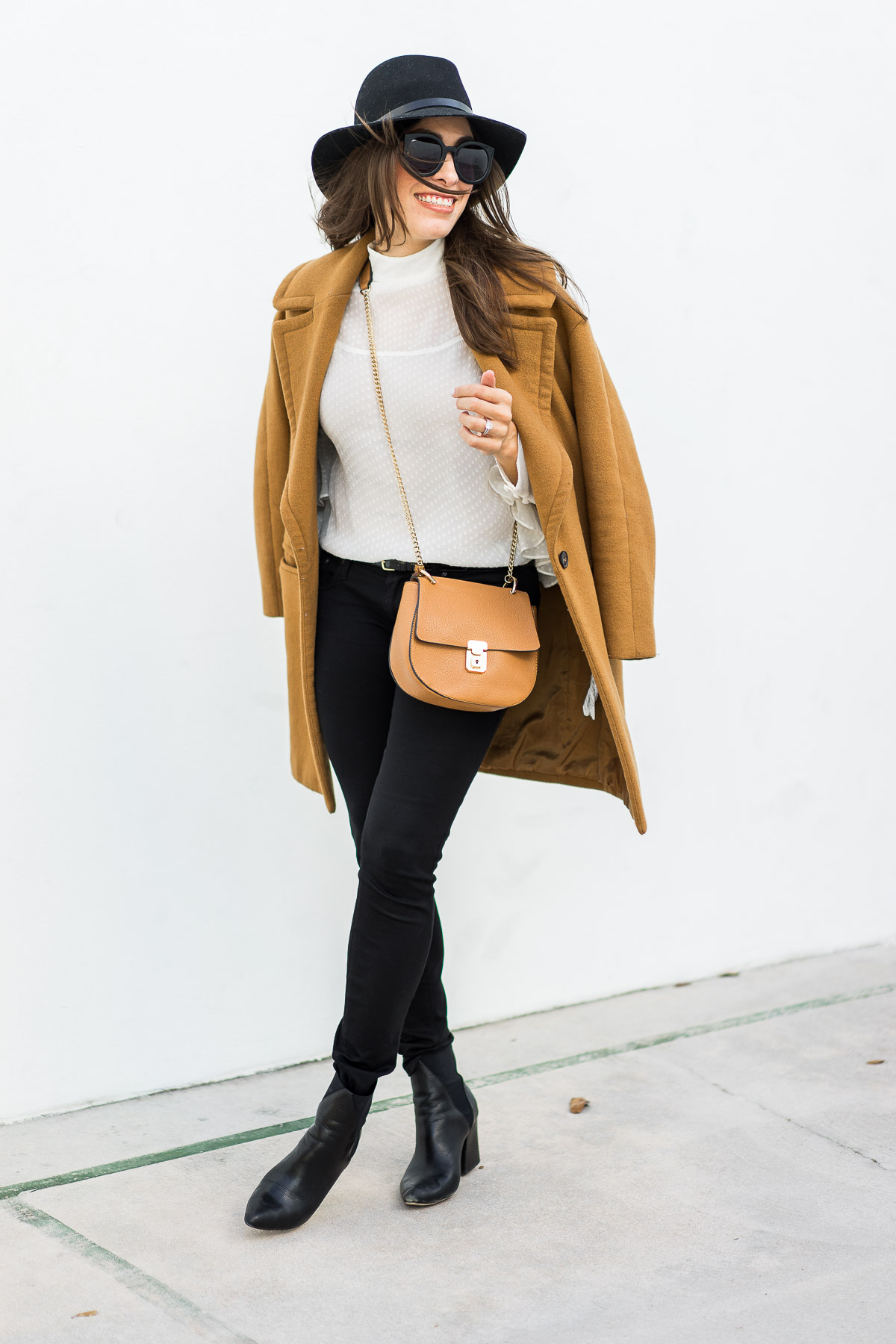 Amanda from Best Luxury Designers Handbags wears oversized lapel camel coat by Zara with sheer white blouse by Chelsea28 and Chloe Drew dupe bag