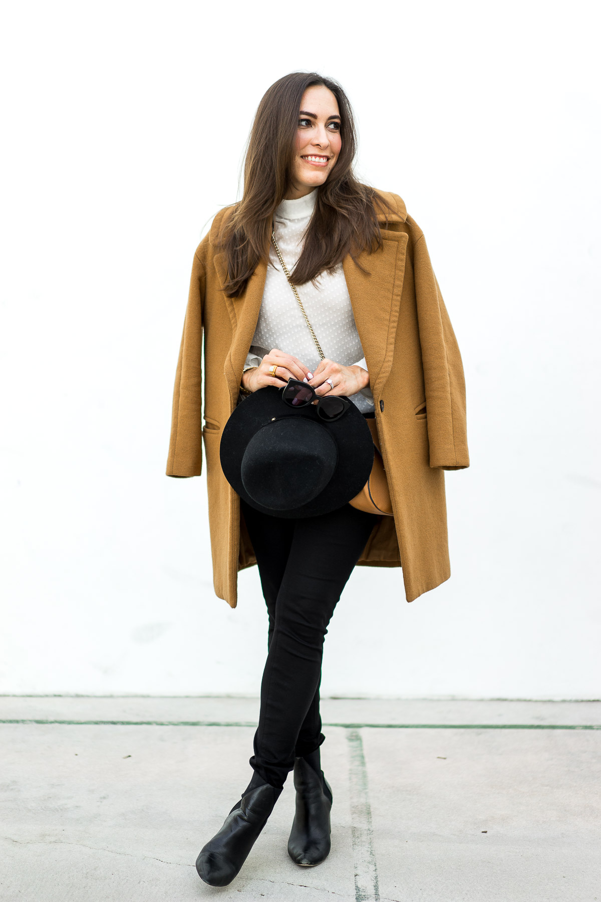 The best winter looks by blogger Best Luxury Designers Handbags in a Zara tan coat carrying Rag and Bone fedora