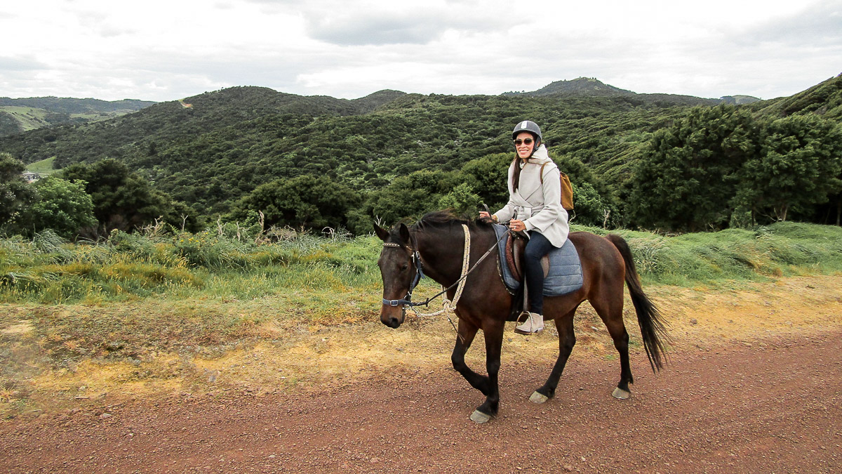 Fashion blogger from Best Luxury Designers Handbags takes a Waiheke Island horseback riding tour in Te Matuku Bay and includes it in best things to do in Waiheke Island