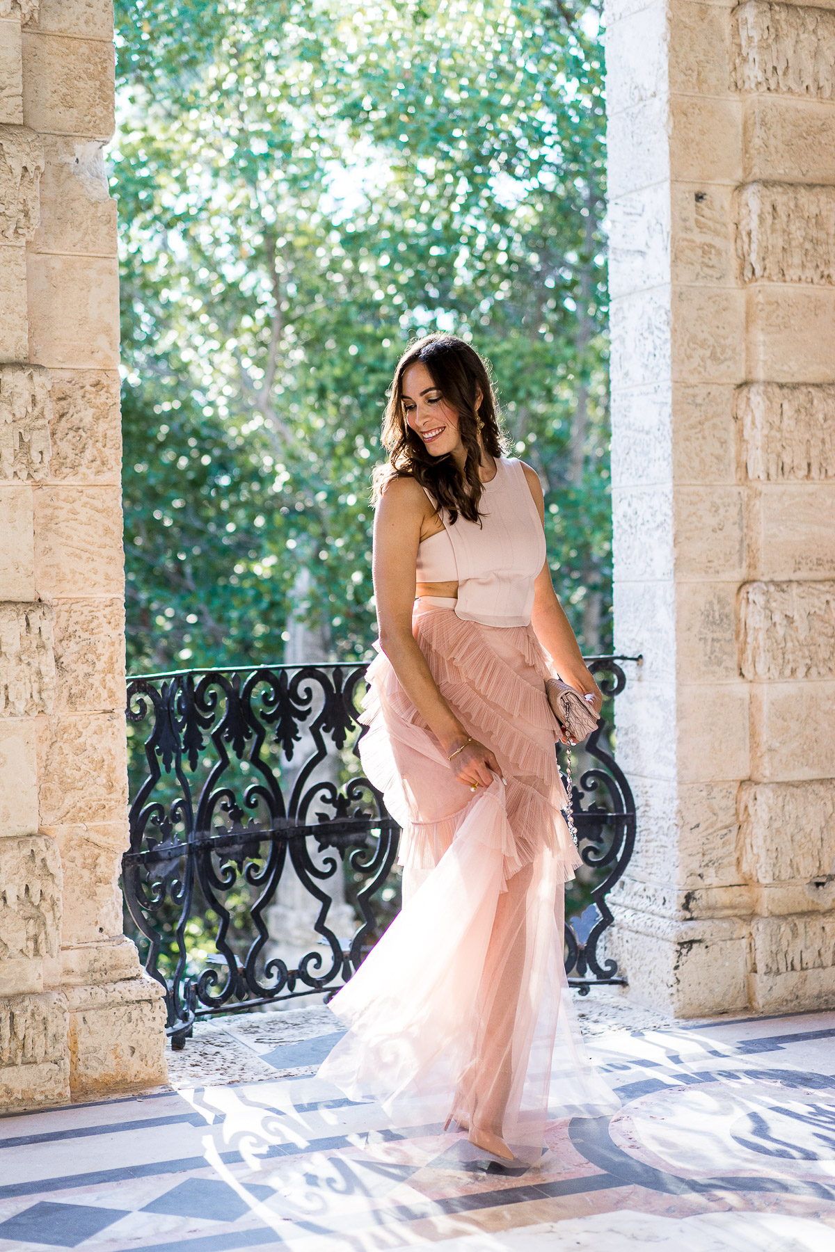 South Florida blogger Amanda from Best Luxury Designers Handbags wears BCBG Avalon blush tulle gown at Viscaya Gardens in Miami