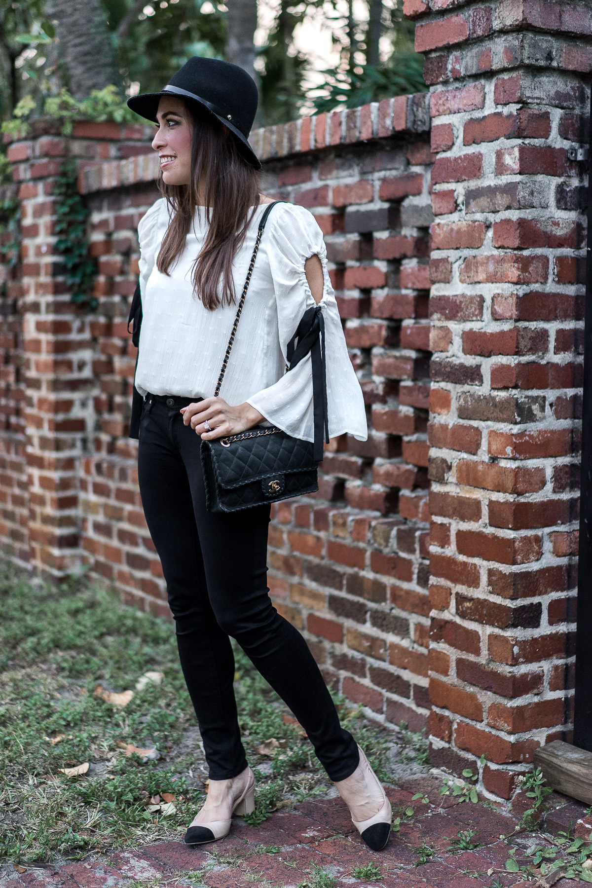 Club Monaco fluttery bell sleeve top with black ribbon details is worn by Best Luxury Designers Handbags blogger Amanda with her favorite AG Legging jeans and Ivanka Trump Liah slingback pumps