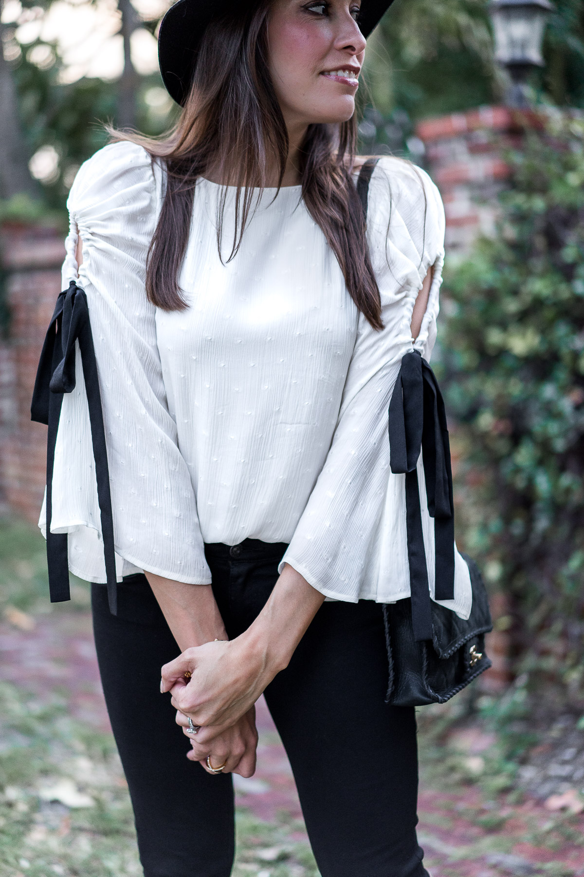 Fluttery bell sleeve top from Club Monaco with black tie details styled by Amanda of Best Luxury Designers Handbags blog