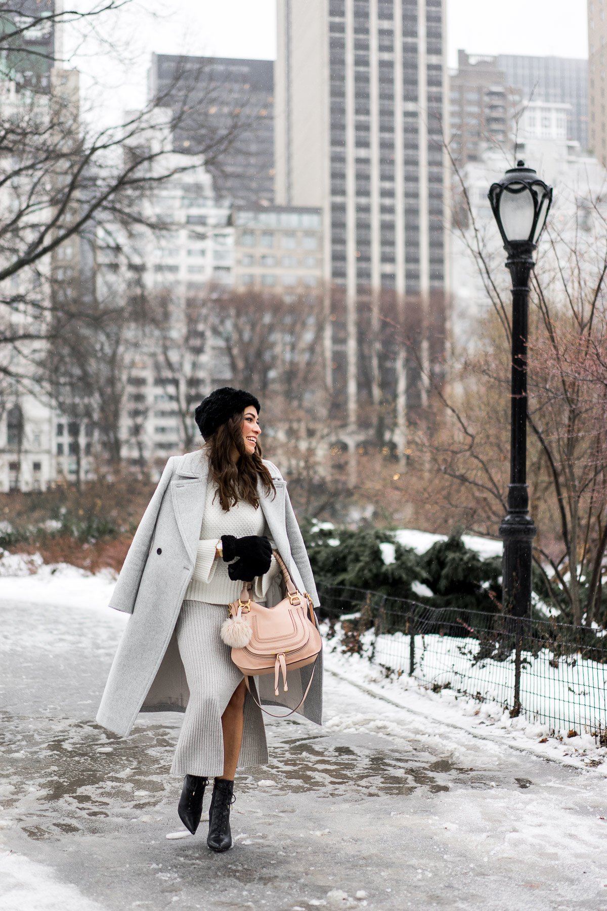 Amanda from Best Luxury Designers Handbags blog styles BCBGeneration grey midi skirt during NYFW with her Chloe Marcie bag and Club Monaco Daylina coat and sweater paired with Sam Edelman military inspired black booties