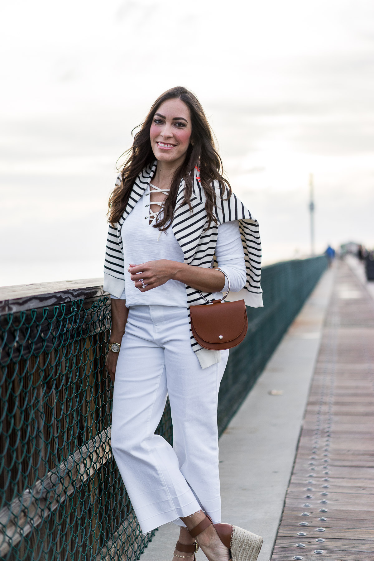 Old Navy striped french terry sweatshirt is a great Spring transitional piece for neutral nautical style styled by Best Luxury Designers Handbags blogger Amanda with Old Navy lace up tee and white wide leg denim