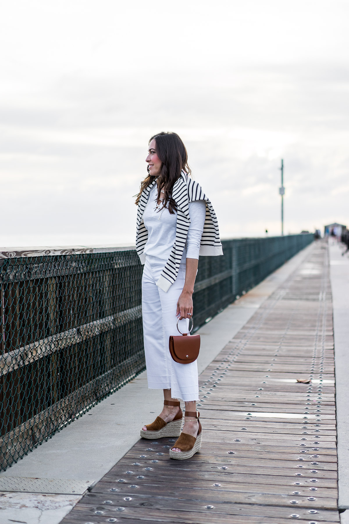 Old Navy lace up tee and Old Navy high waist white ankle jeans with Old Navy striped sweatshirt are styled by Amanda of Best Luxury Designers Handbags 