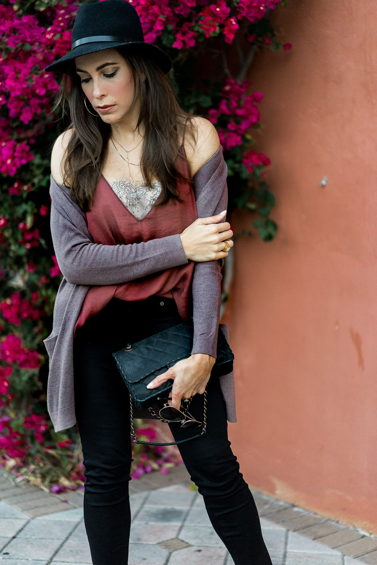 Amanda of A GlamLifestyle blog with her draped Old Navy open front cardigan while carrying her classic Chanel bag