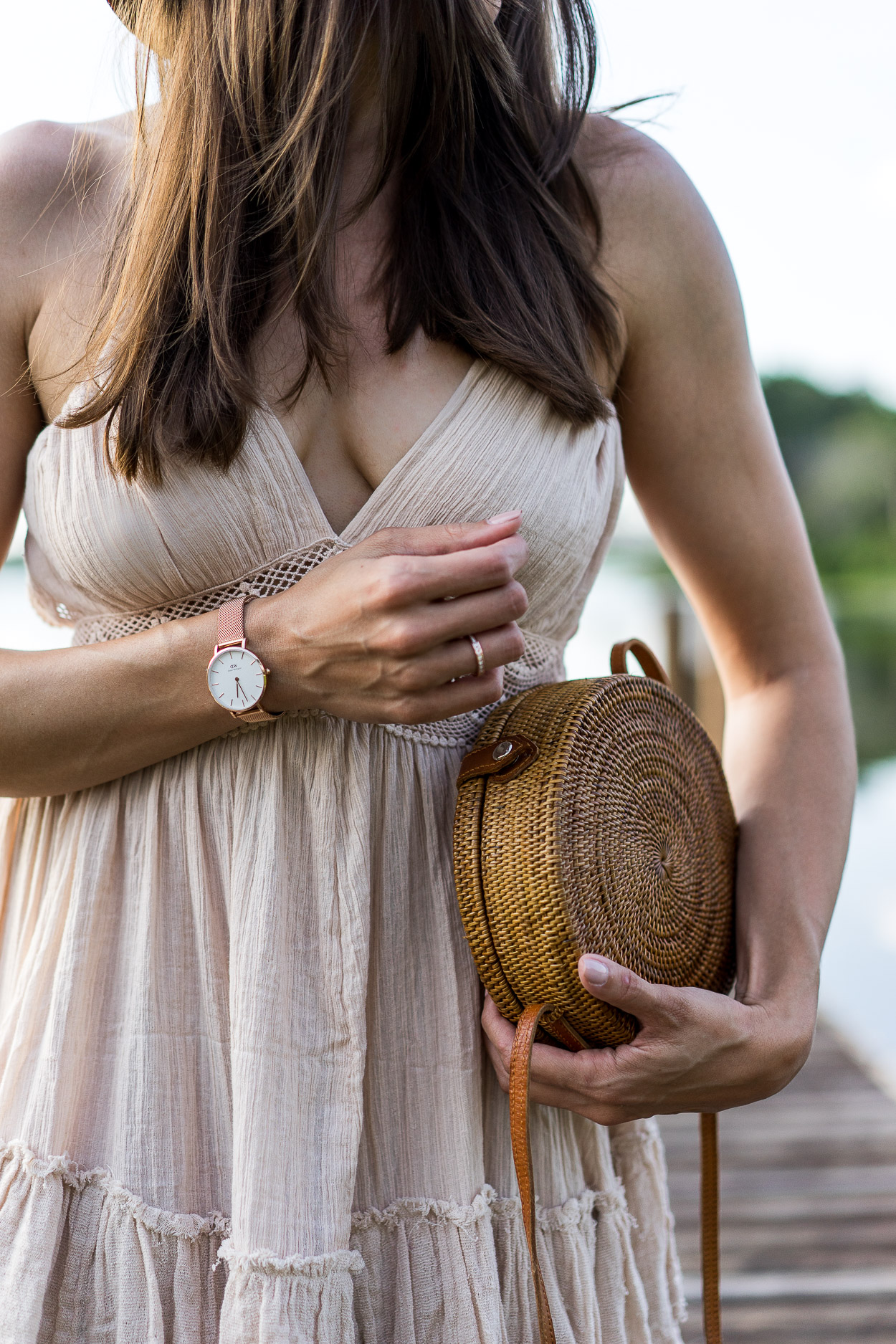 Amanda of Best Luxury Designers Handbags blog wears Daniel Wellington Classic Petite Rose Gold watch with Free People 200 Degrees mini dress and round basket bag for essential Summer style