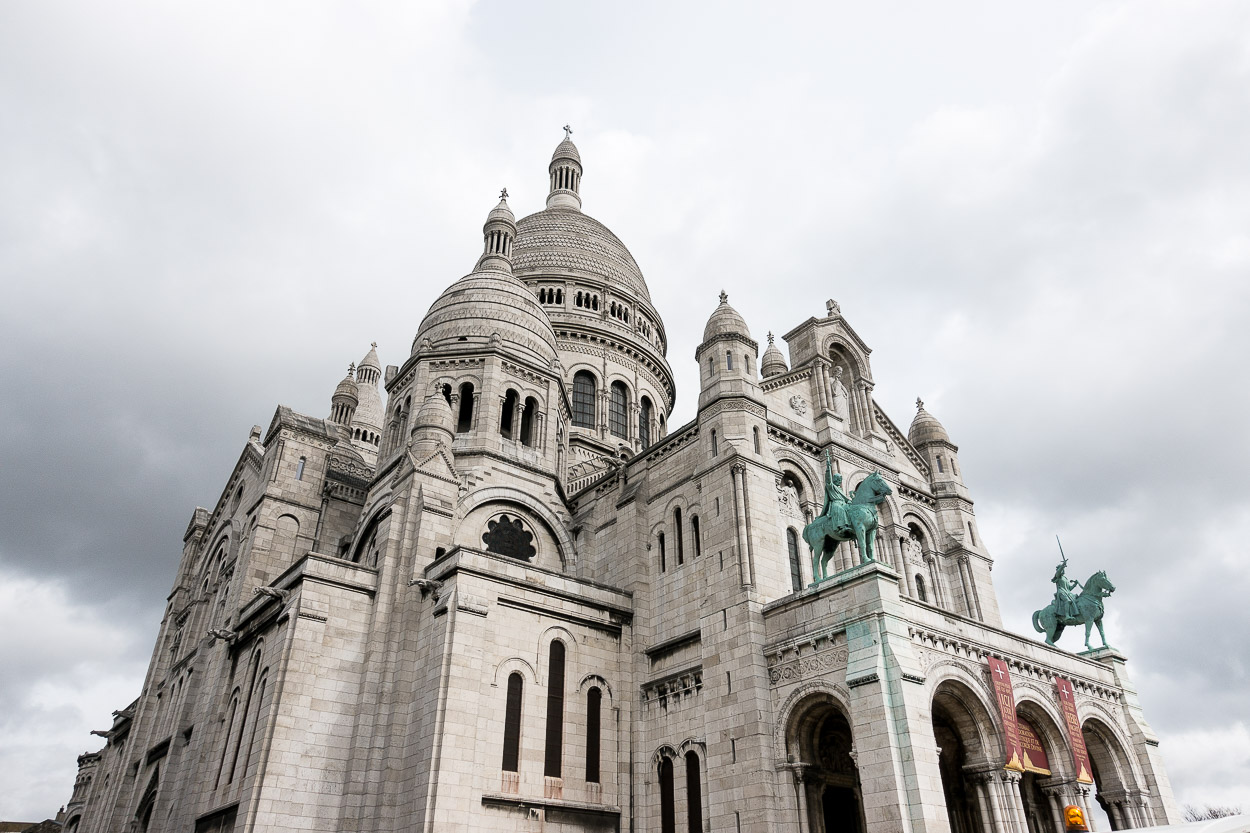 Visiting the Sacre Coeur church is one of the best things to do in Montmartre recommended by Best Luxury Designers Handbags blogger Amanda for planning a trip to Paris