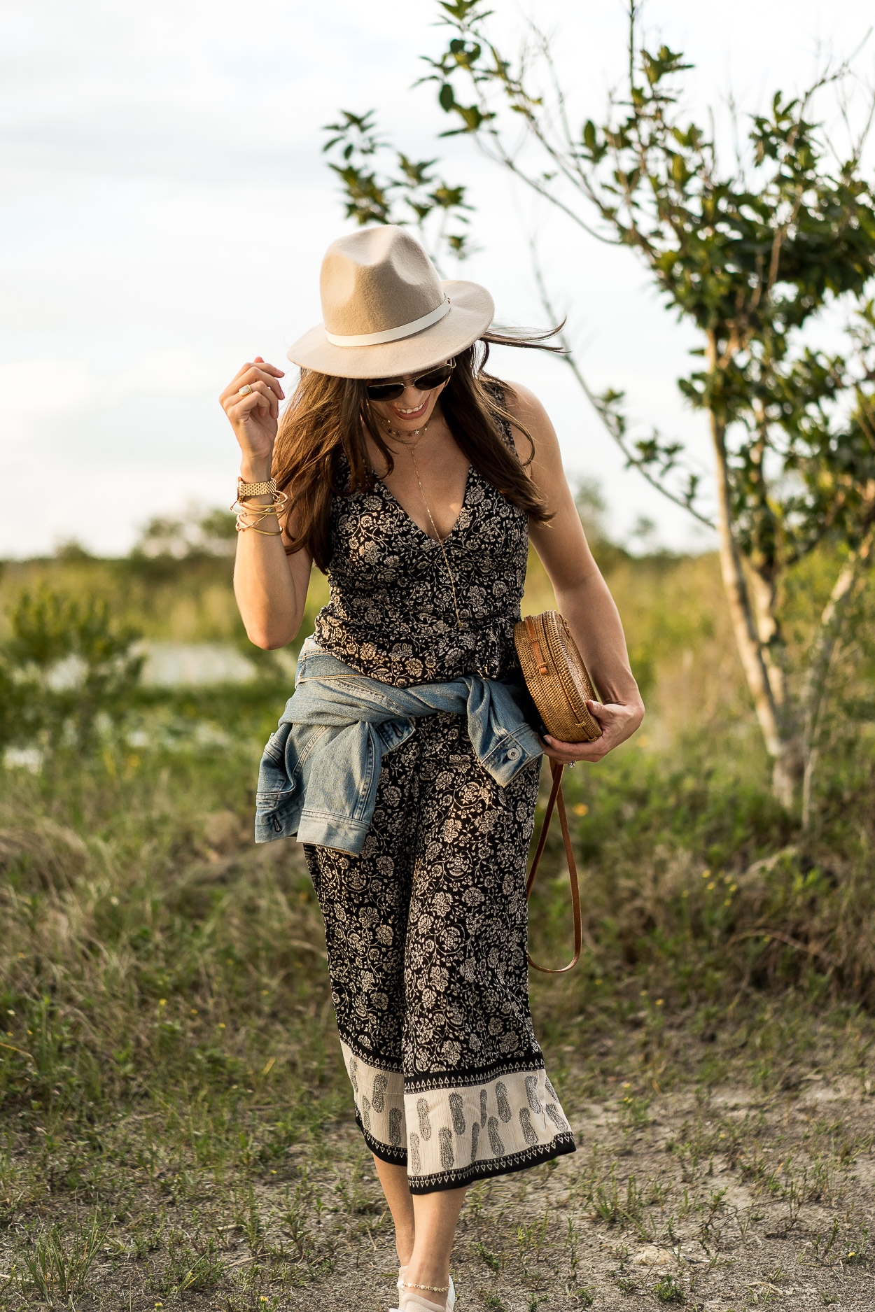 A boho style jumpsuit is a perfect Summer outfit as worn by fashion blogger Amanda of Best Luxury Designers Handbags