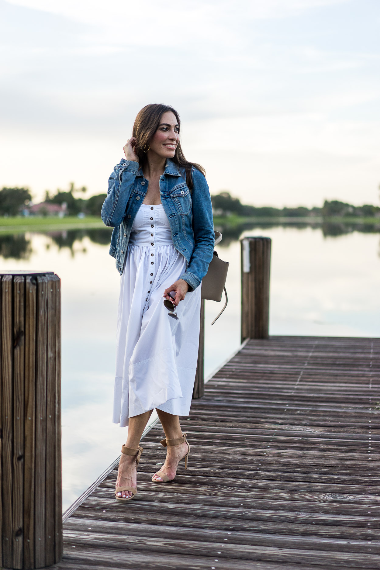 Top off your Summer white dress with a classic denim jacket by AG Jeans like blogger Amanda of Best Luxury Designers Handbags