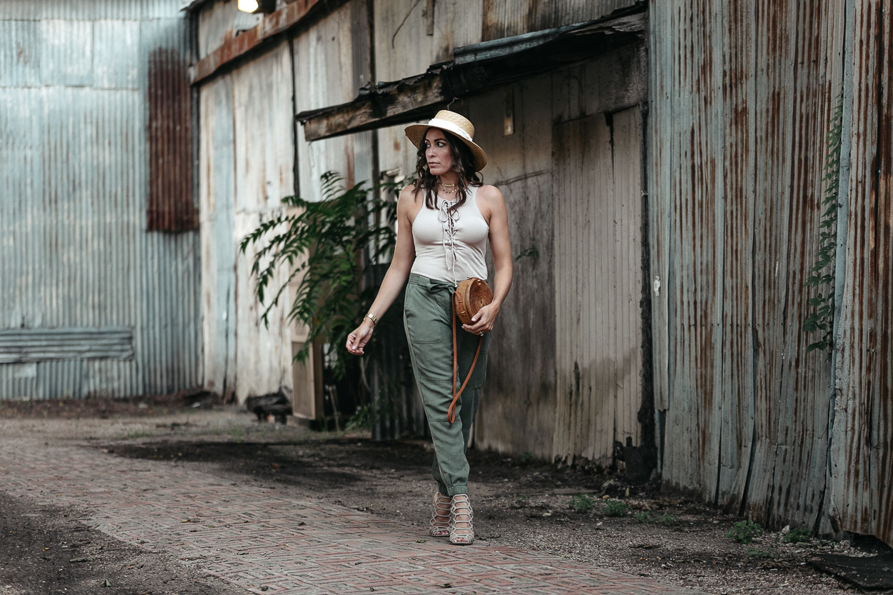 Easy Summer style includes a lace up bodysuit and cargo pants like Amanda of Best Luxury Designers Handbags blog wears in Dallas