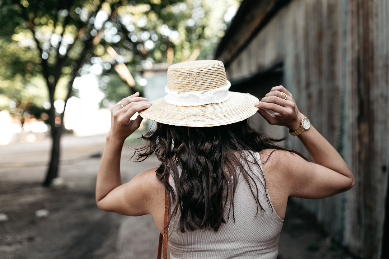 Amanda of Best Luxury Designers Handbags blog grabs her Rag and Bone straw boater hat with her lace up bodysuit for hot Summer days