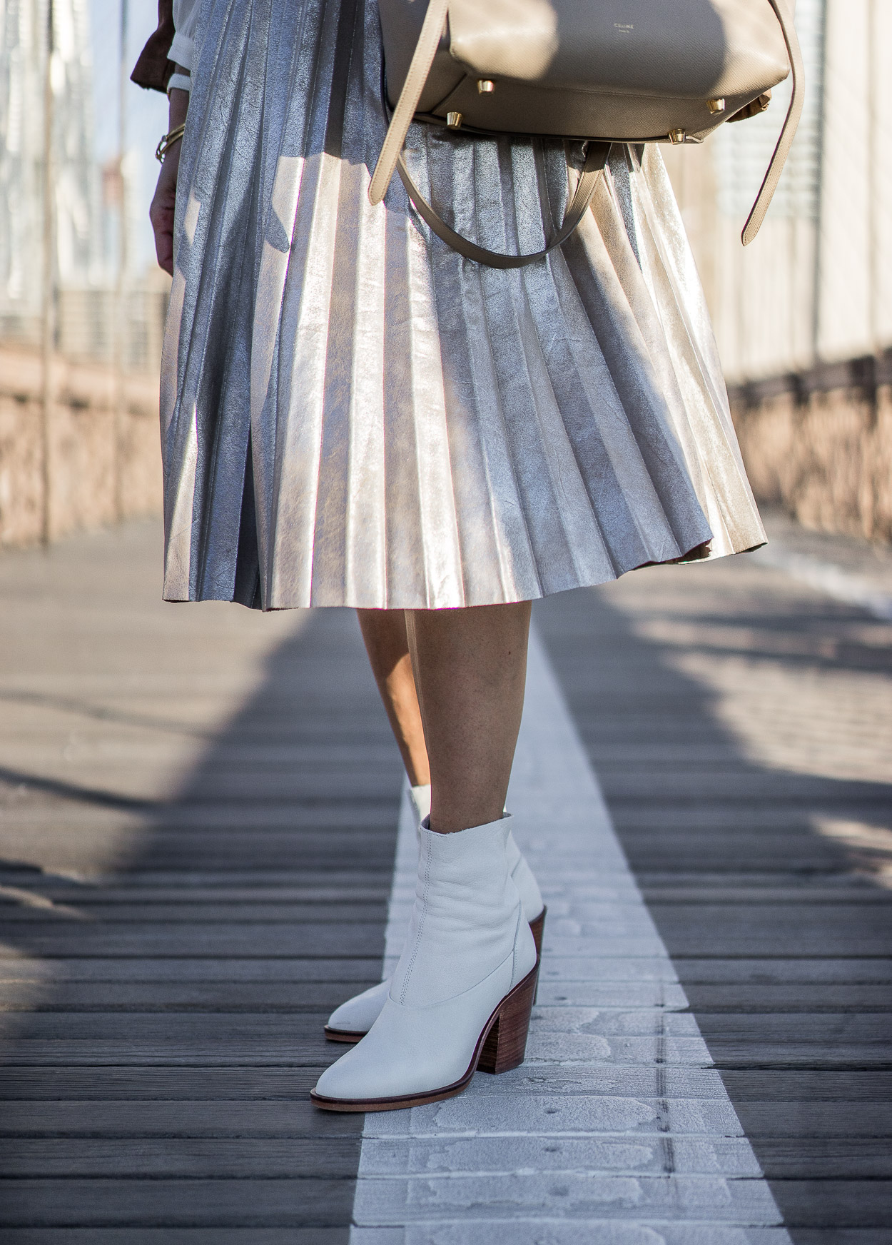 Pair your metallic pleated skirt with white sock booties from Topshop this Fall a la blogger Amanda from Best Luxury Designers Handbags