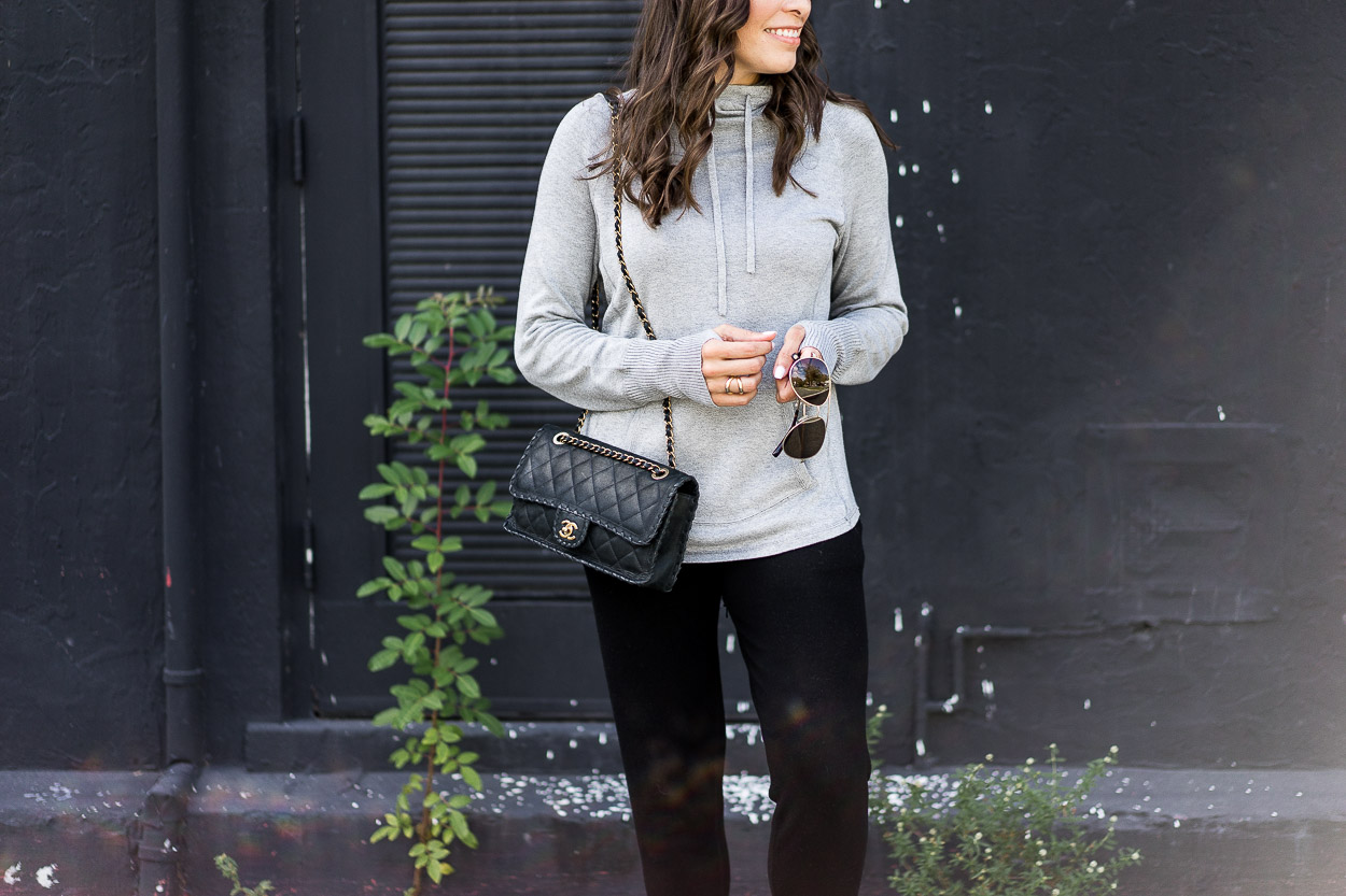 Grey cashmere hoodie is simple airport style when paired with classic Chanel bag and Warby Parker aviators like Amanda of Best Luxury Designers Handbags blog