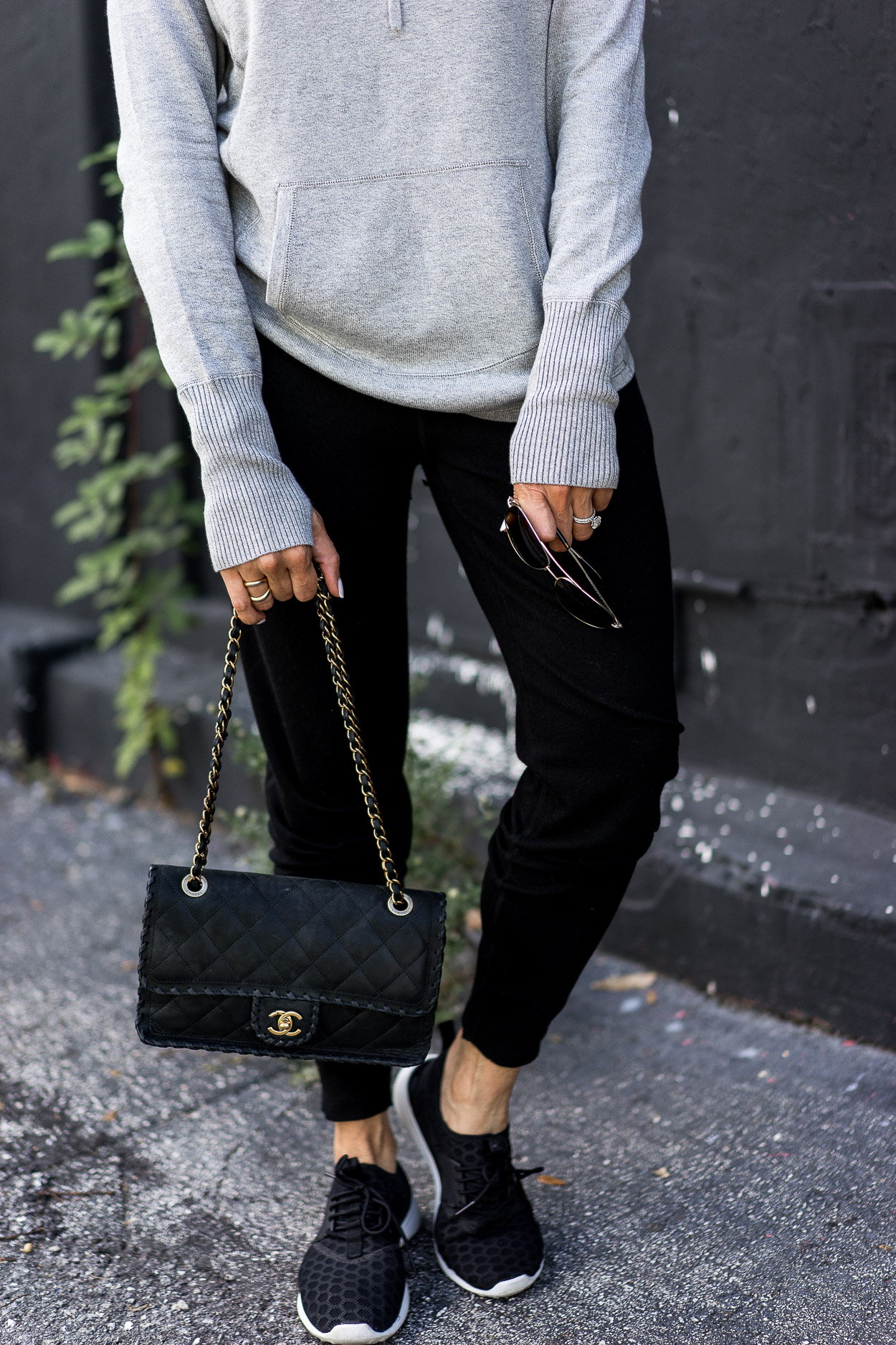 Leimere cashmere joggers review by Best Luxury Designers Handbags blog who paired the affordable cashmere with her Chanel bag and Nike sneakers