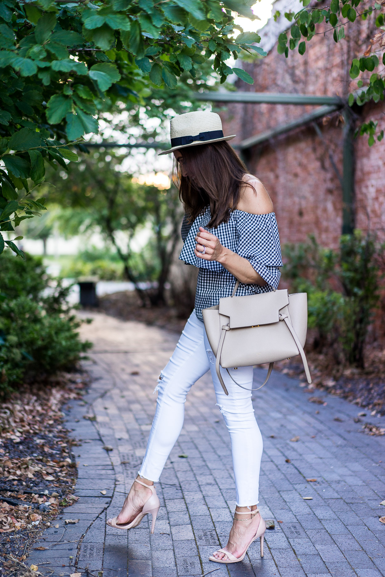 Easily transition your wardrobe from Summer to Fall with this Wayf gingham top and crisp white AG jeans a la blogger Amanda of Best Luxury Designers Handbags