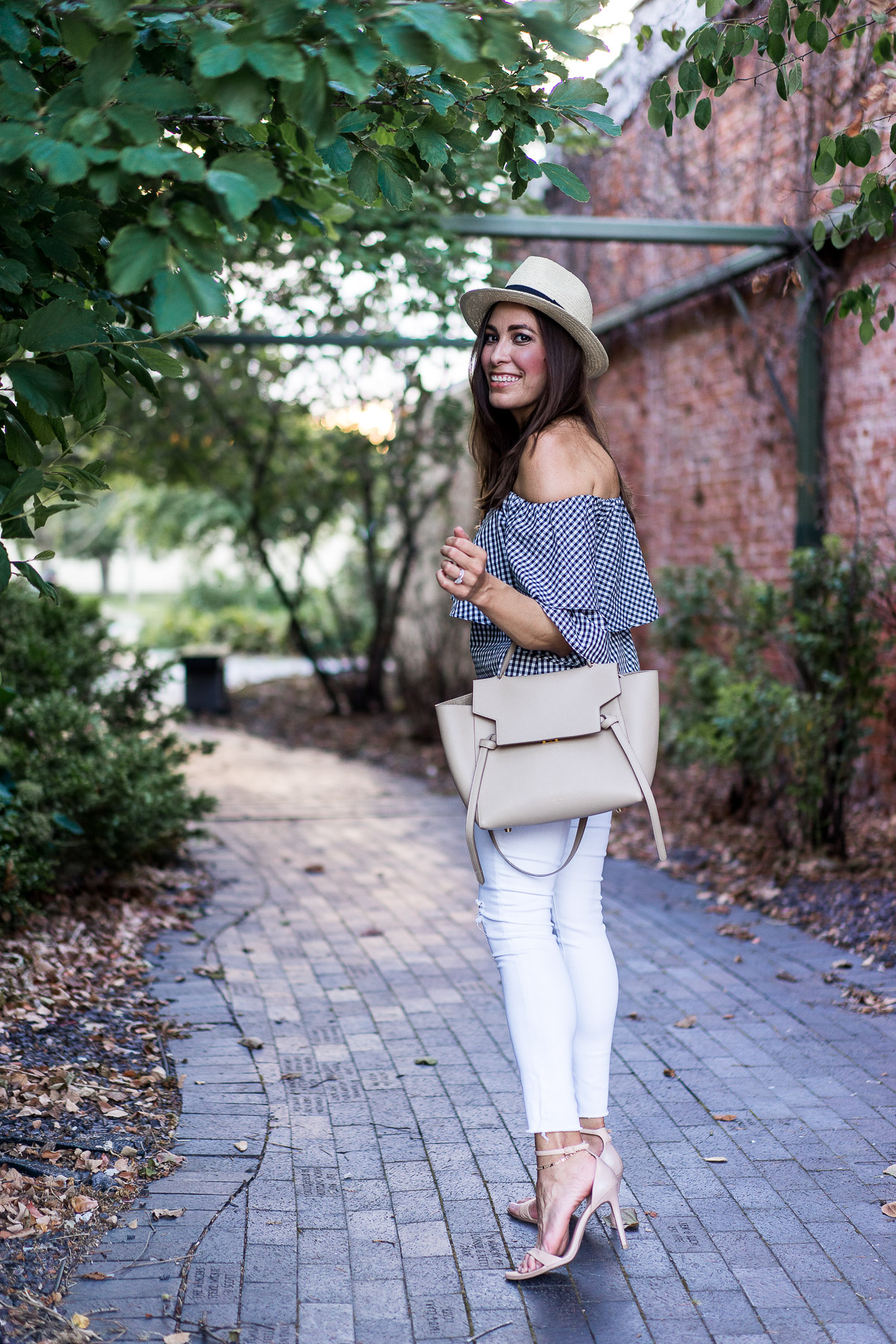 Wear a Wayf gingham top with your favorite white legging jeans like Amanda from Best Luxury Designers Handbags to transition your wardrobe from Summer to Fall