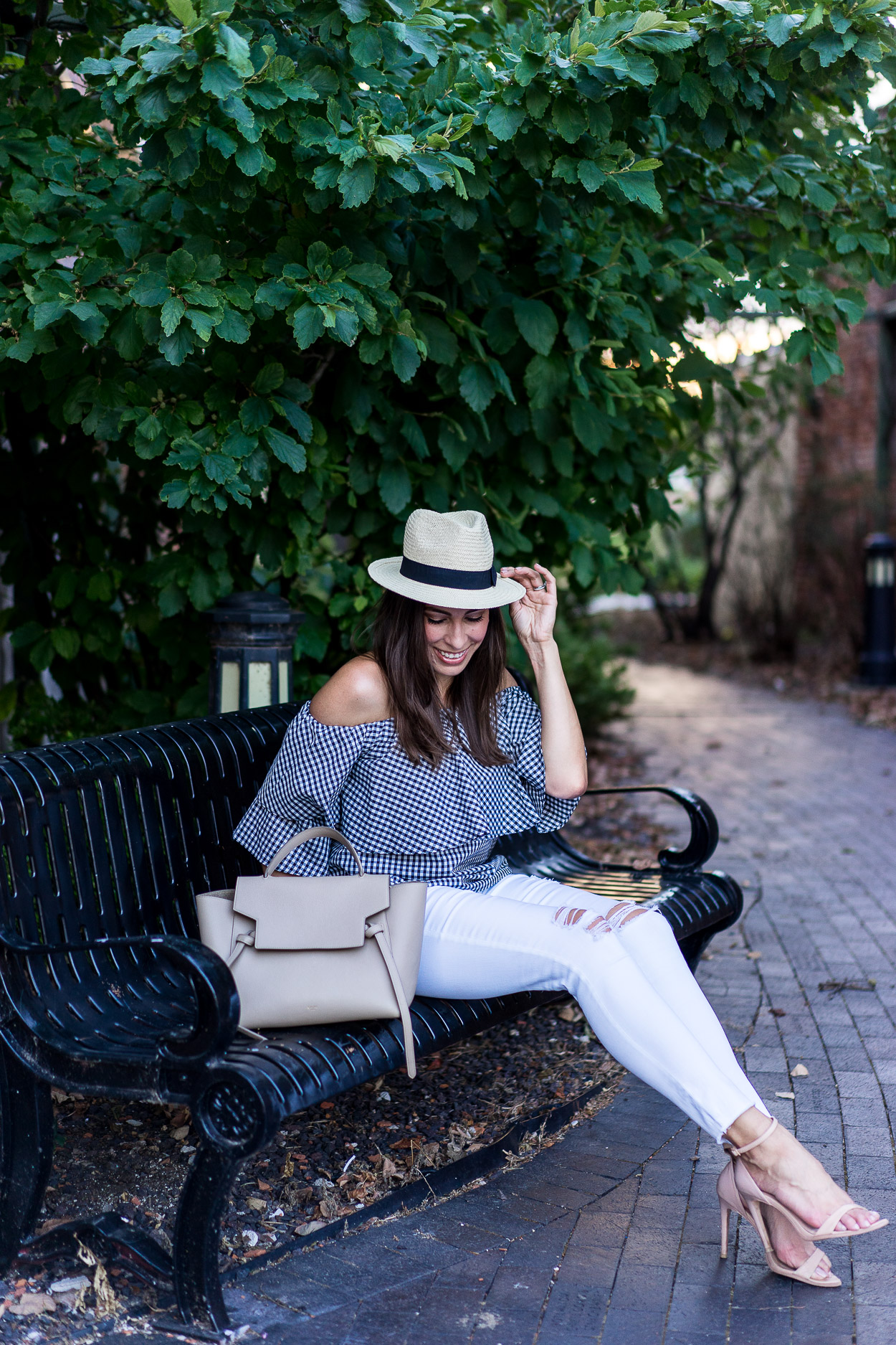 Amanda of Best Luxury Designers Handbags blog wears Wayf gingham top with white distressed AG jeans and Celine belt bag for Fall transitional style