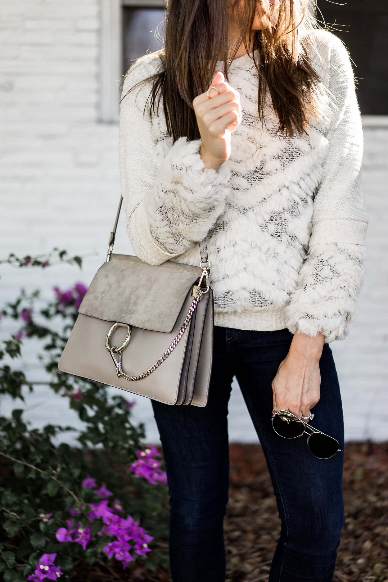 Amanda from Best Luxury Designers Handbags blog wears an Anthropologie textured sweatershirt as one of her fave cozy sweaters