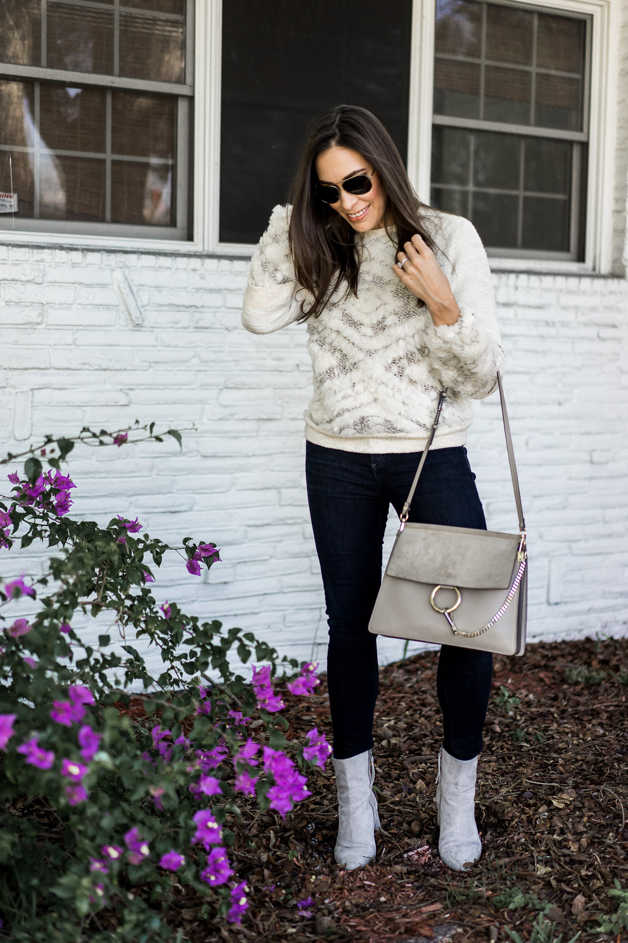 Top Quality Luxury Handbag Shop where Anthropologie knit, jeans, and white boots