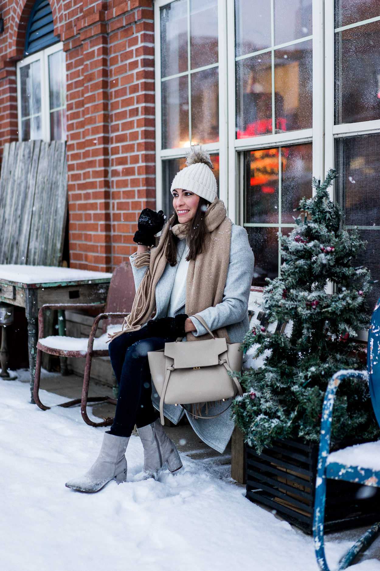 Amanda of Best Luxury Designers Handbags sitting outside the snow