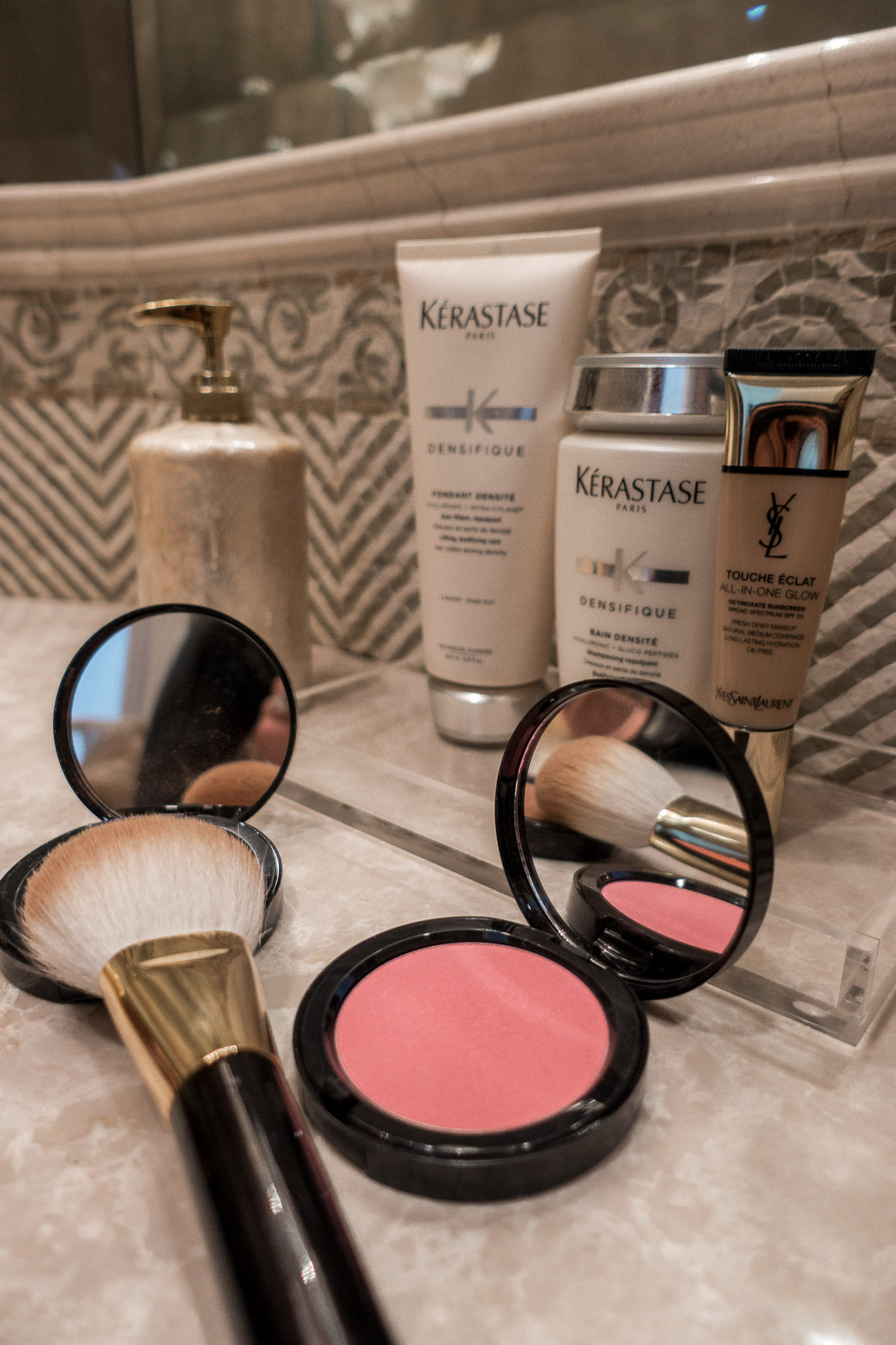 Amanda of Best Luxury Designers Handbags shares her July beauty faves, including the YSL touche eclat all in one glow, Bobbi Brown bali brown bronzer and the Tom Ford bronzer brush