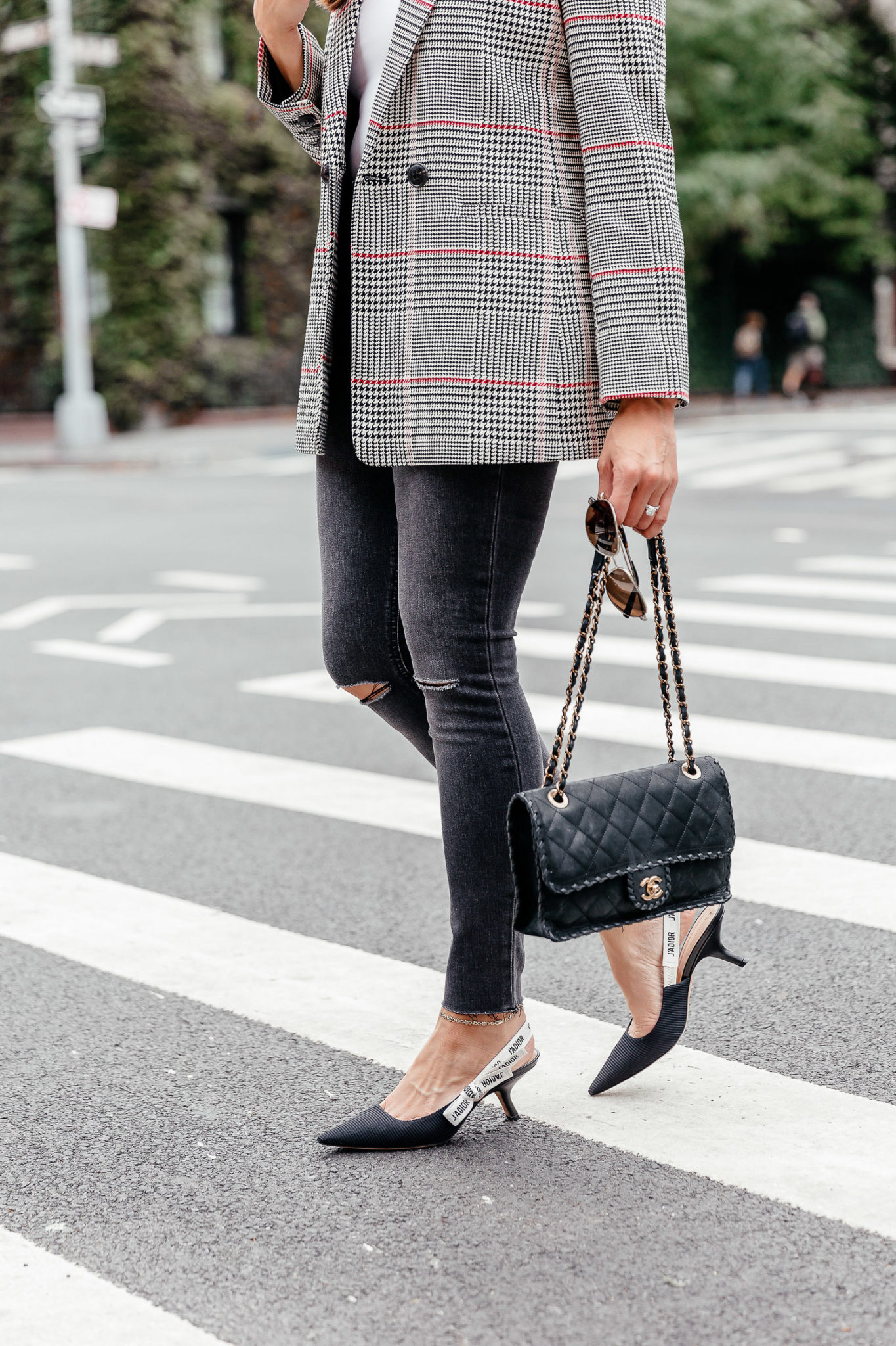 An easy Fall trend to adopt is the plaid blazer, seen here on South Florida fashion blogger Amanda of Best Luxury Designers Handbags during NYFW with her Dior kitten heels and grey Wrangler denim