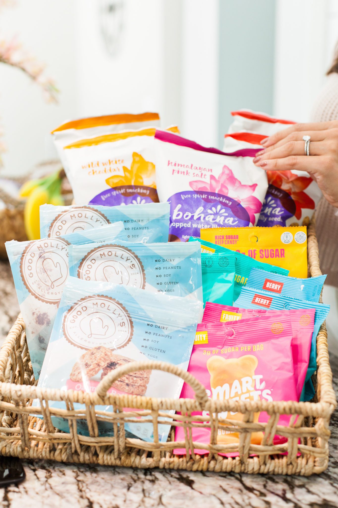 Healthy Snack Ideas for Working From Home by popular Florida lifestyle blog, Best Luxury Designers Handbags: image of Smart Sweets, Bohana snacks, and Good Molly's snacks. 