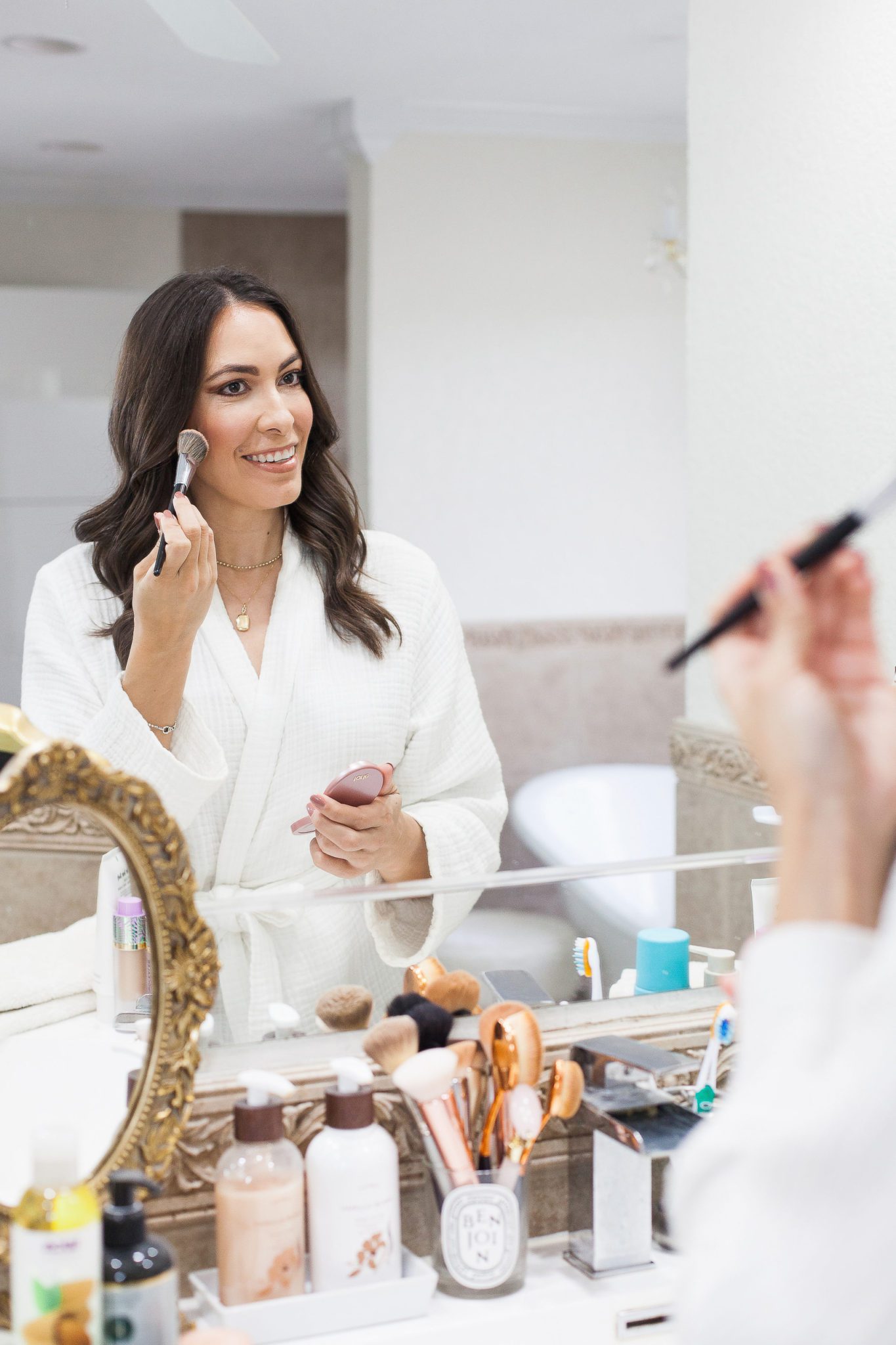 Top Quality Luxury Handbag Shop doing her cheeks for her Natural Soft Glam Makeup Tutorial